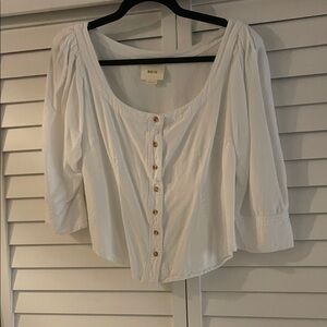 Beautiful white comfortable shirt. Buttons down the front and one on each sleeve
